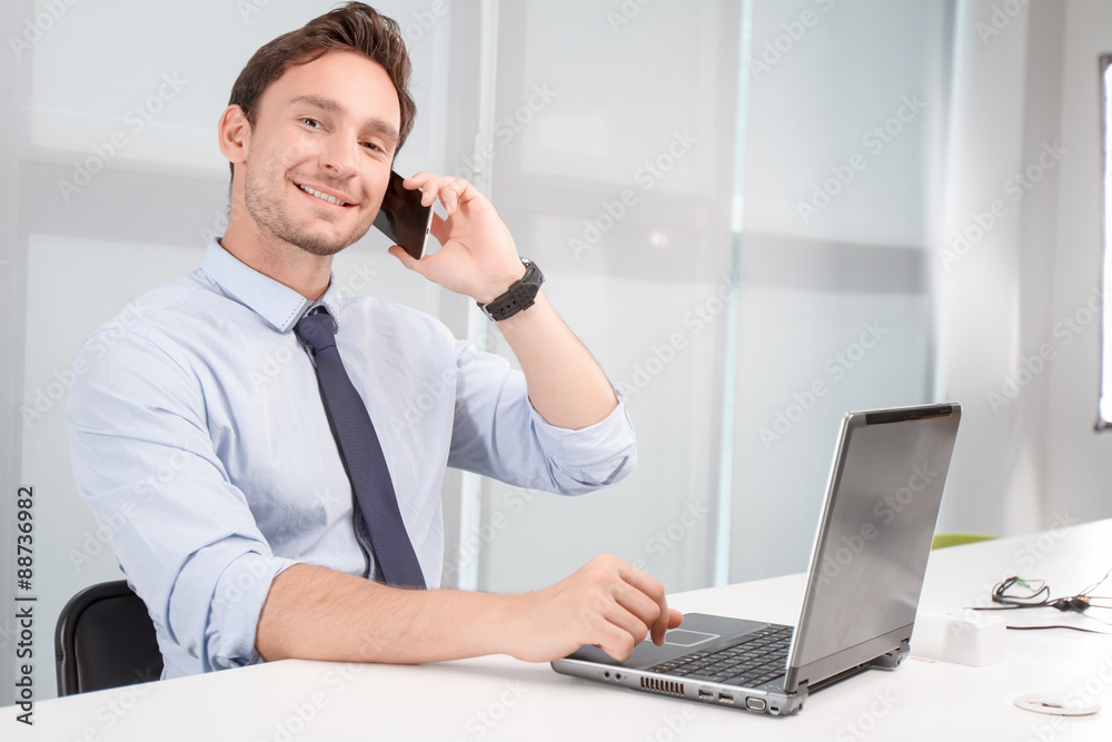 Call center operator holding mobile phone Call center operator holding mobile phone