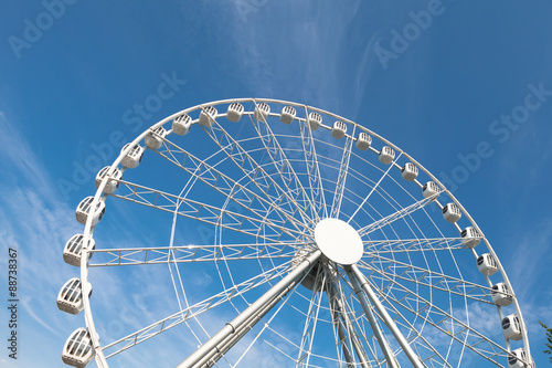 white ferris wheel against blue sky background
