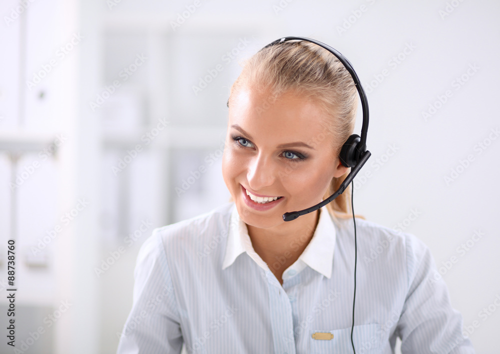 Close-up portrait of a customer service agent sitting at office Close-up portrait of a customer service agent sitting at office