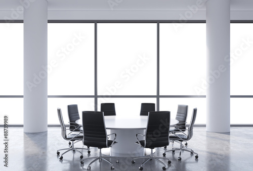 Panoramic conference room in modern office, copy space view from the windows. Black chairs and a white round table. 3D rendering.