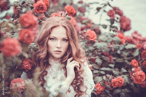 фотографія Portrait of young woman in the spring time. Almond flowers bloss