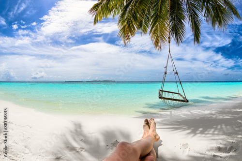 relaxing under coco palm on...