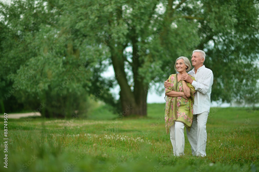 Mature couple on in summer park Mature couple on in summer park