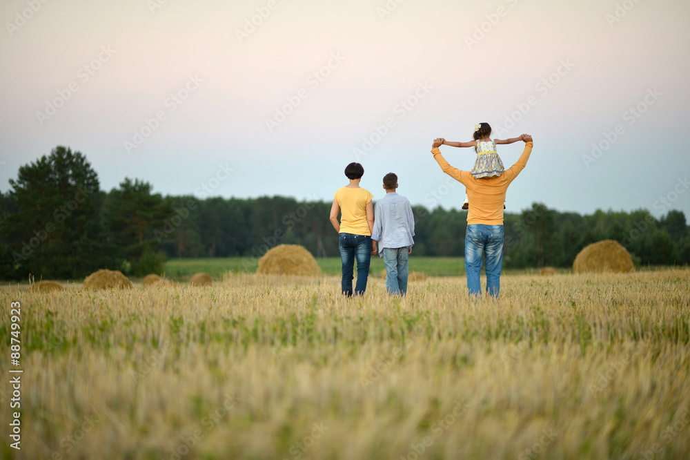 Happy family in wheat field