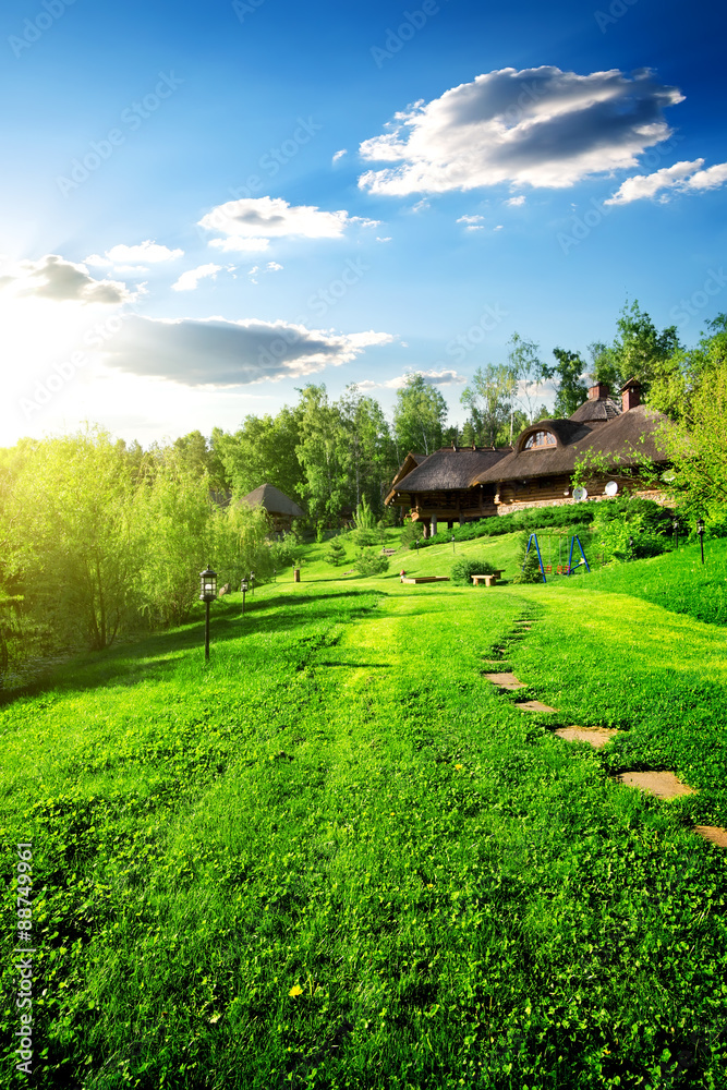 Wooden houses on meadow Wooden houses on meadow