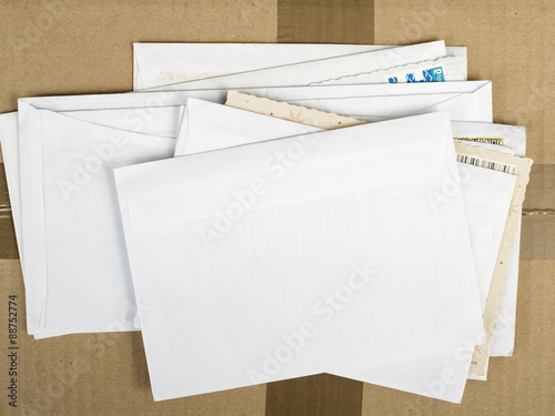 a pile of letters and postal parcel