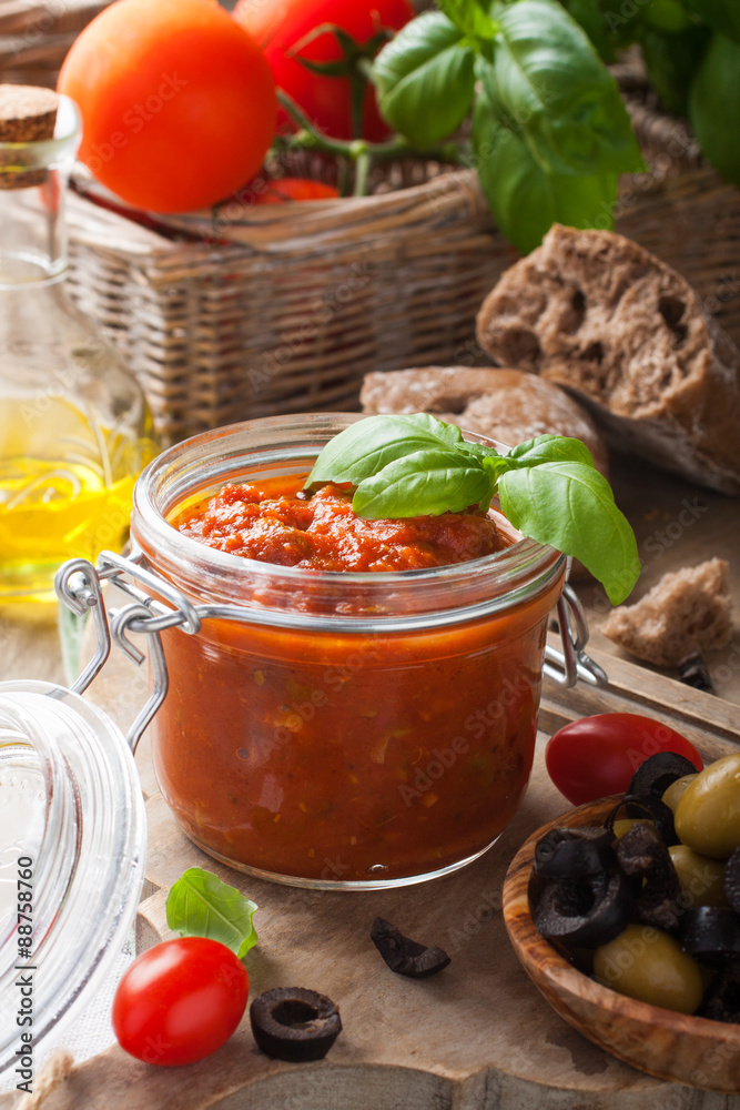 Glass jar with homemade tomato pasta sauce Glass jar with homemade tomato pasta sauce