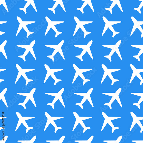White plane icons on blue background seamless pattern