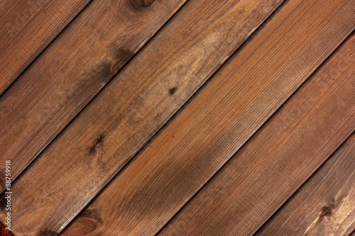 Textured rustic wooden dark brown table background.