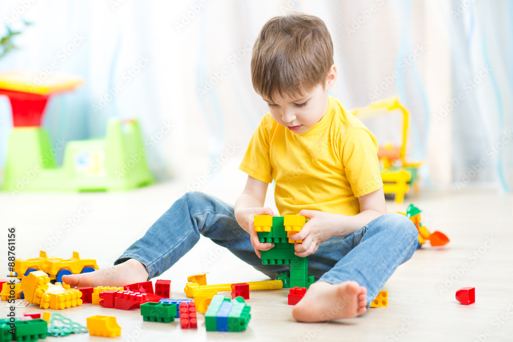 little boy playing with cubes little boy playing with cubes