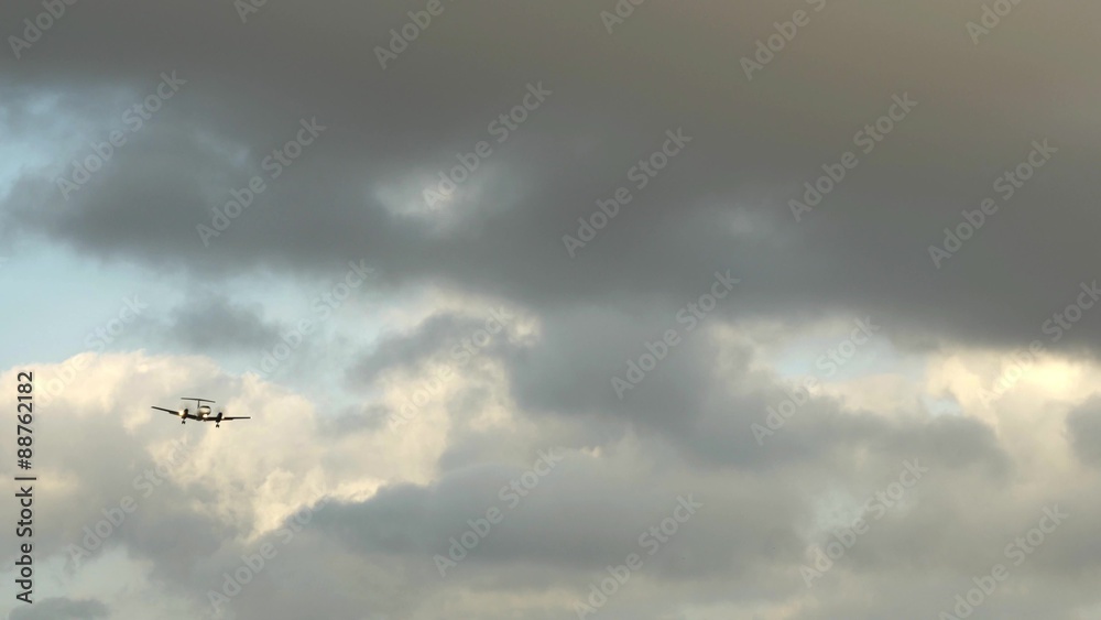 Turboprop airplane landing with cloudy sky 4K UHD Turboprop airplane landing with cloudy sky 4K UHD