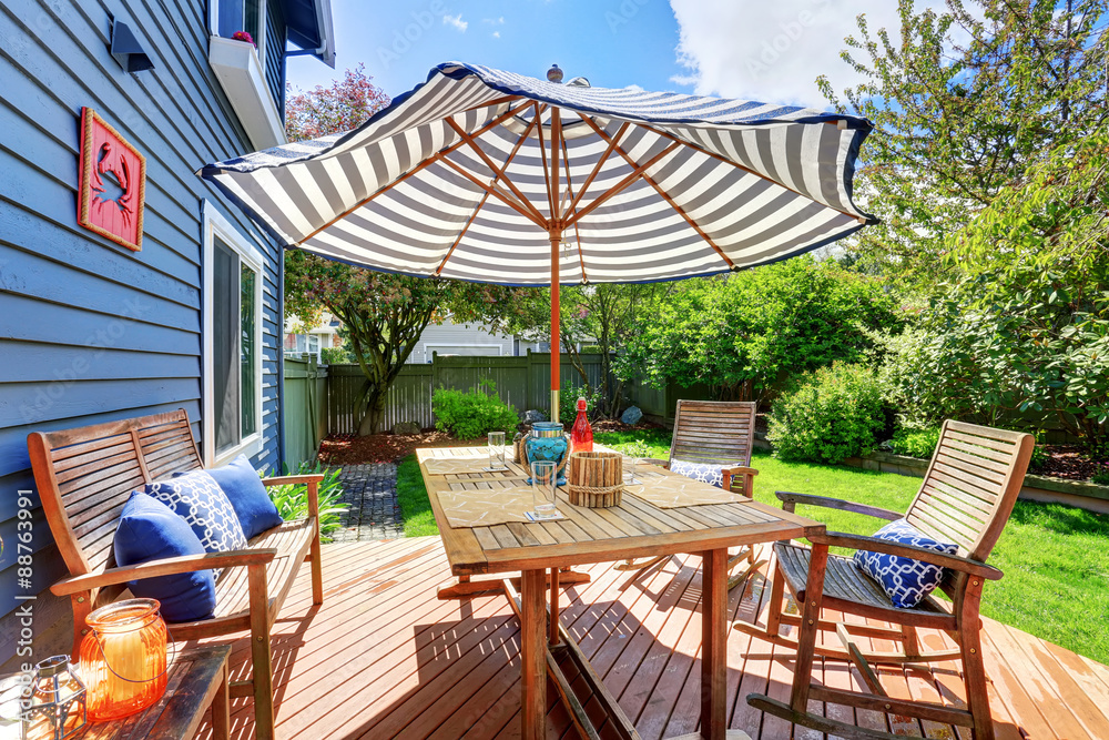 Fototapeta premium Picture perfect back deck with covered seating.