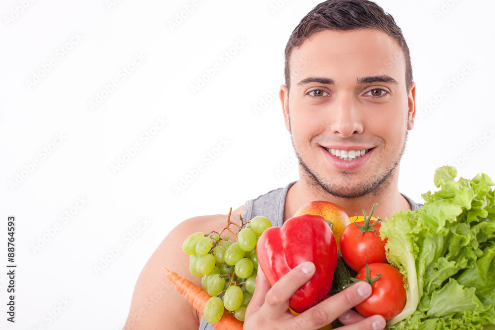 Handsome young fit guy prefers healthy eating Handsome young fit guy prefers healthy eating