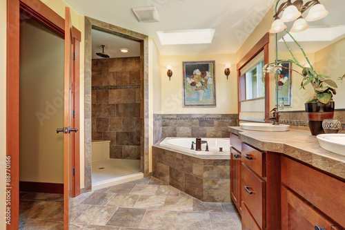 Lovely master bathroom with stone floor.