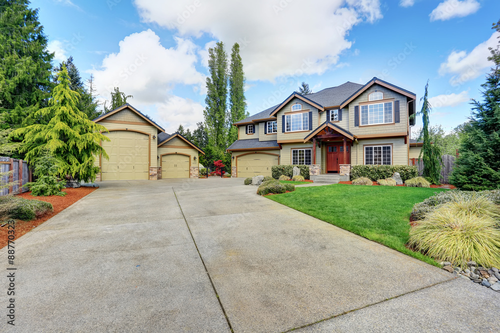 Luxurious home with large driveway.