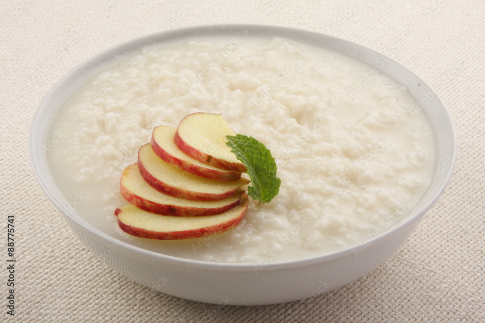 Rice pudding with milk cream and apples. Rice pudding with milk cream and apples.