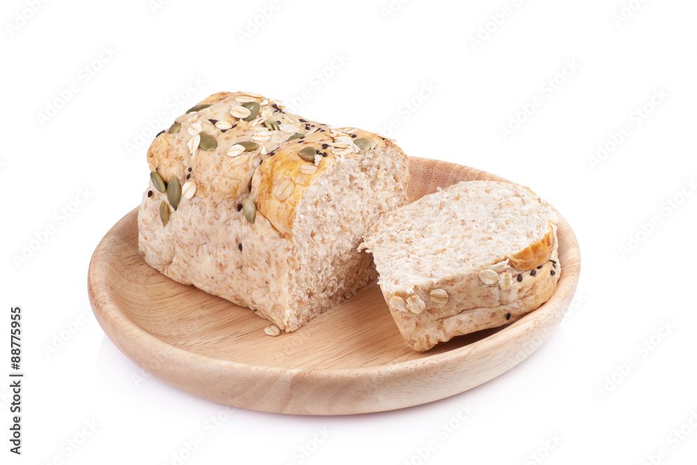 whole wheat bread in the wooden plates isolated on white backgro