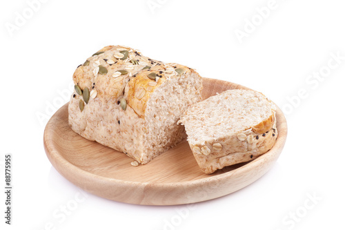 whole wheat bread in the wooden plates isolated on white backgro