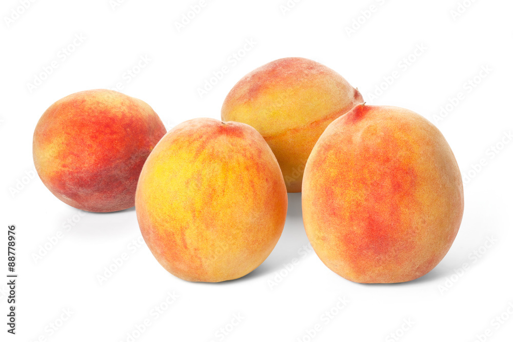 Four ripe peaches on a white background Four ripe peaches on a white background