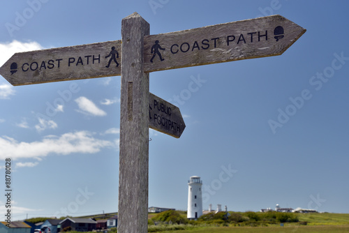 Signpost on Dorset coastal path at Portland Bill