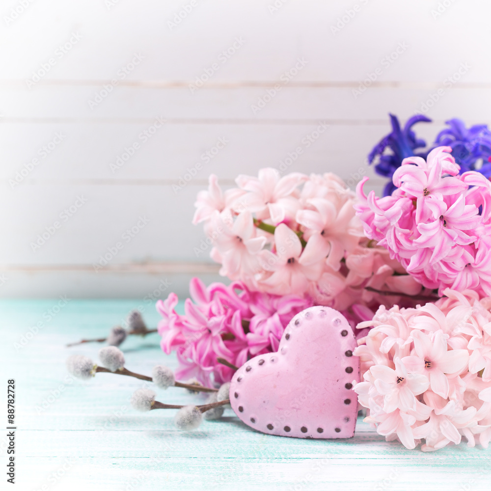 Background with fresh flowers hyacinths and decorative pink hea Background with fresh flowers hyacinths and decorative pink hea