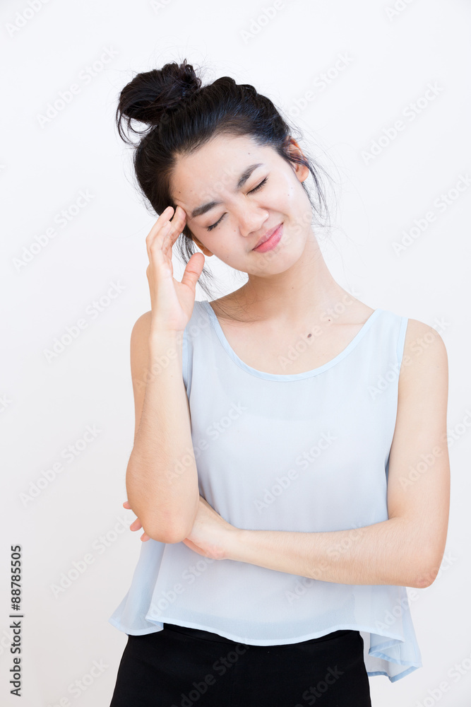 Young asian student suffering from a headache Young asian student suffering from a headache