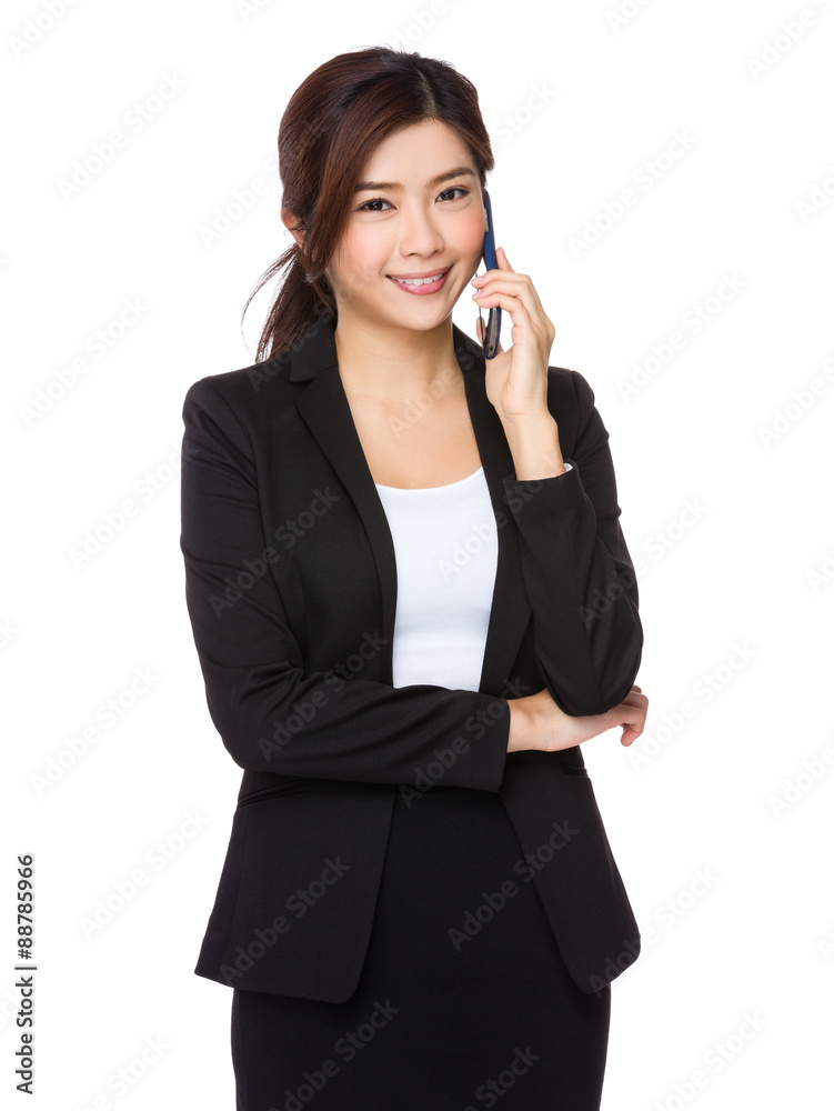 Asian businesswoman talk to mobile phone Asian businesswoman talk to mobile phone