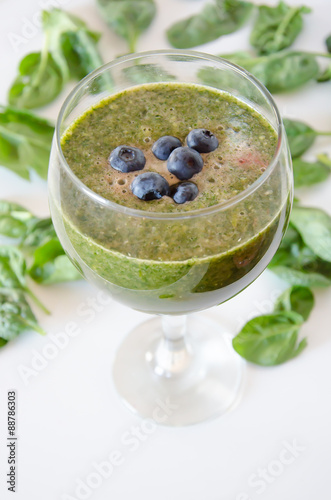 Green Cocktail with berries on top
