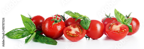 Cherry tomatoes with basil isolated on white