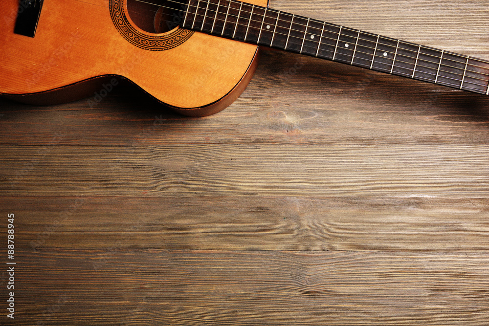 Acoustic guitar on wooden background Acoustic guitar on wooden background