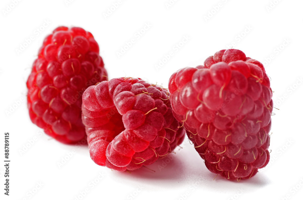 Red sweet raspberries isolated on white