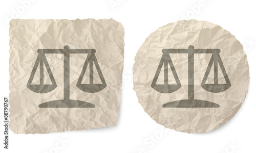 Crumpled slip of paper and a justice symbol