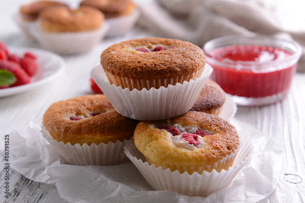 Delicious cupcakes with berries on table close up Delicious cupcakes with berries on table close up