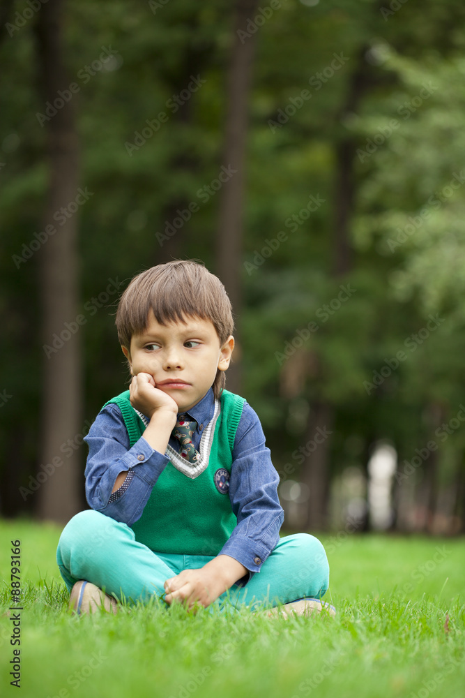 Fashionable little boy outdoor at the nice summer day Fashionable little boy outdoor at the nice summer day