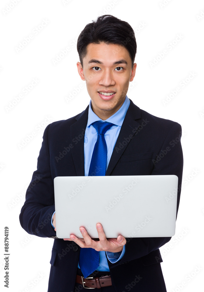 Asian young businessman use of the notebook computer Asian young businessman use of the notebook computer