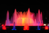 Night show of Magic Fountain of Montjuïc with different colors in Barcelona. Spain.  