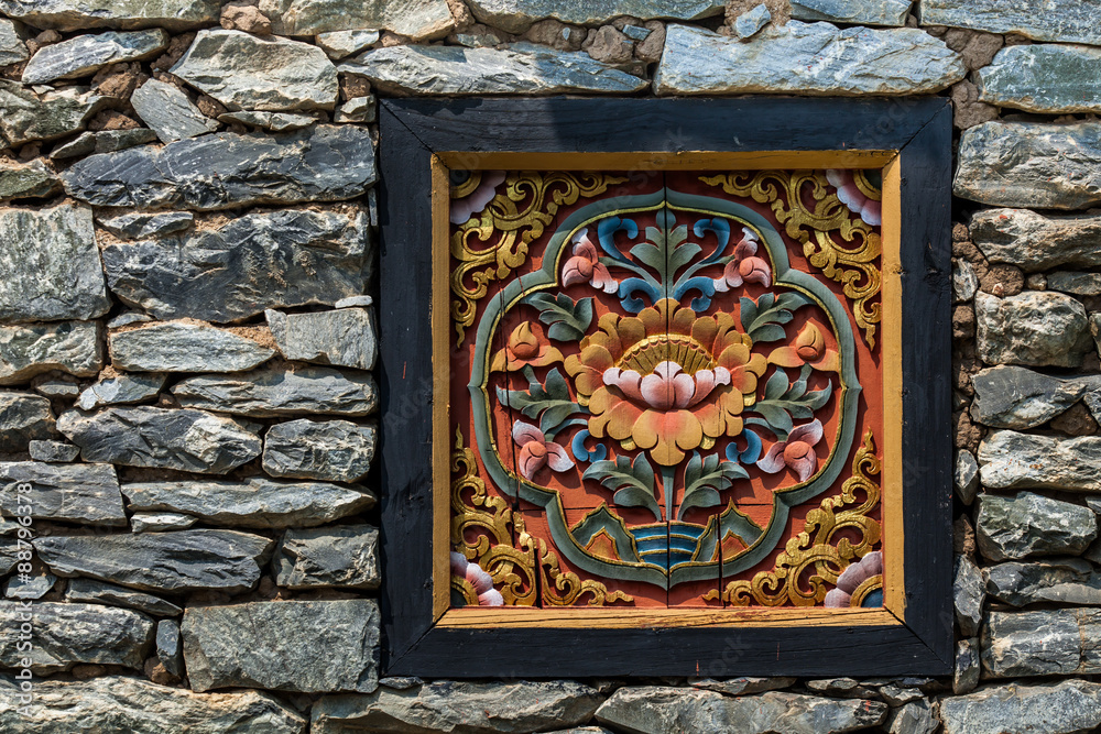 Chinese wooden window decorated inside with stone wall.