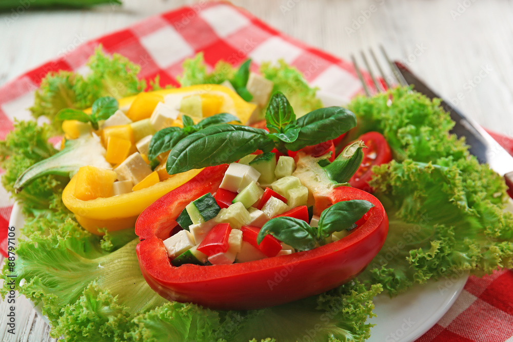 Fresh green salad in pepper on table close up Fresh green salad in pepper on table close up