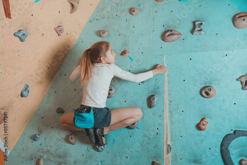 Little girl climbing indoor