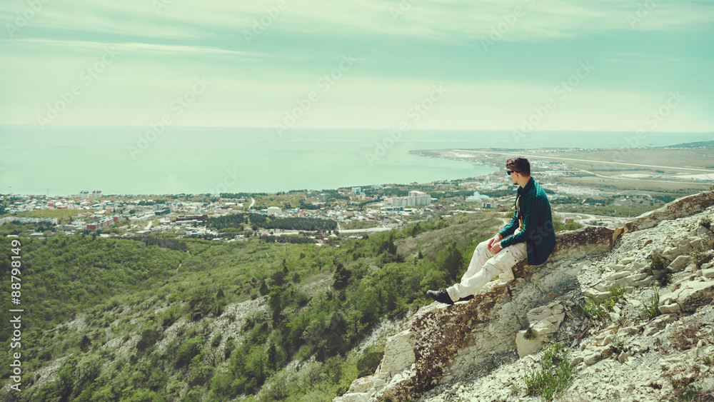 Young man enjoying view of sea in summer