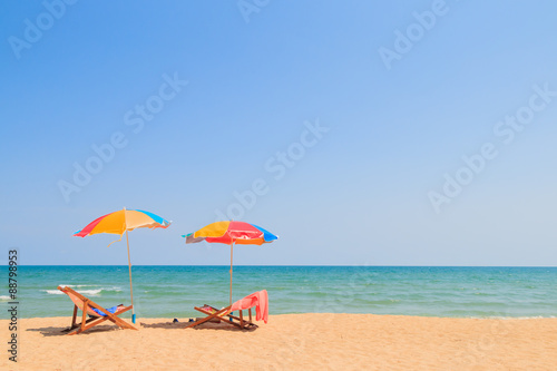 Fototapeta Naklejka Na Ścianę i Meble -  Beach chair and umbrella on sand beach