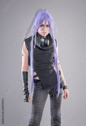 Foto Female fantasy warrior / Female warrior with gas mask isolated on the gray backg