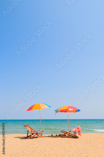 Beach chair and umbrella on sand beach © thawornnurak