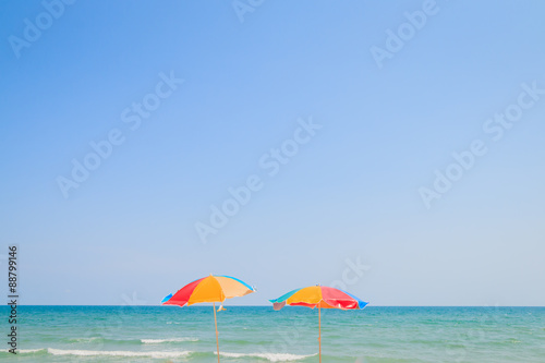 Beach chair and umbrella on sand beach © thawornnurak