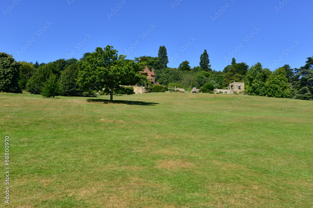 An English country estate and woodland on a hot day in August.