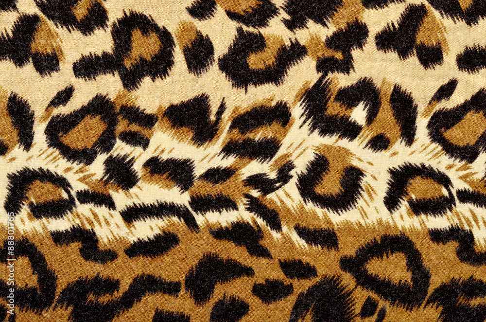 Brown leopard fur pattern. Spotted animal print as background. Brown leopard fur pattern. Spotted animal print as background.