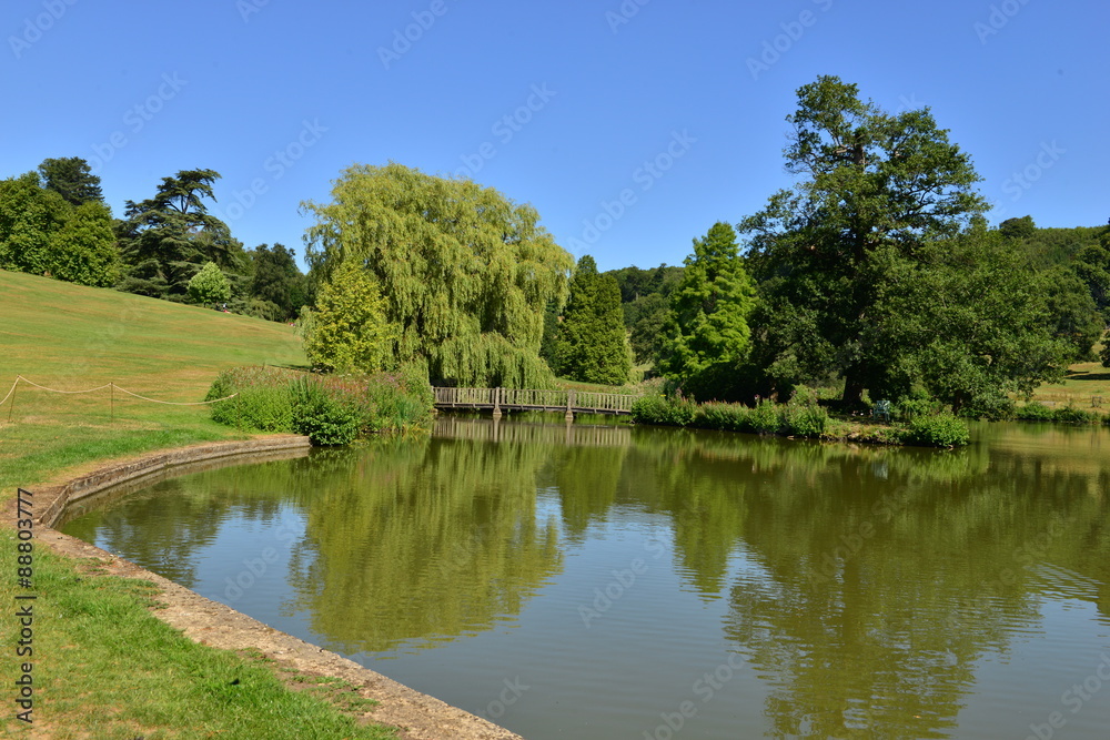 A lake at an English country estate in August,