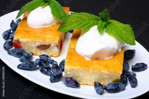 Appetizing cottage cheese casserole with berries and sour cream