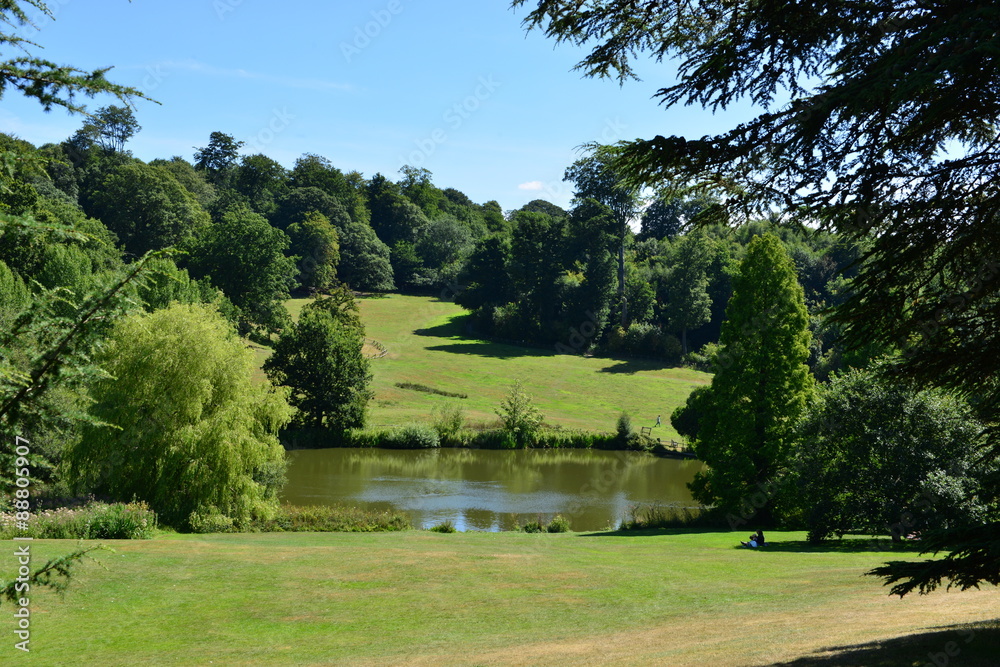 A lake at an English country estate in August,
