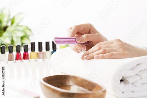 Woman using nailfile